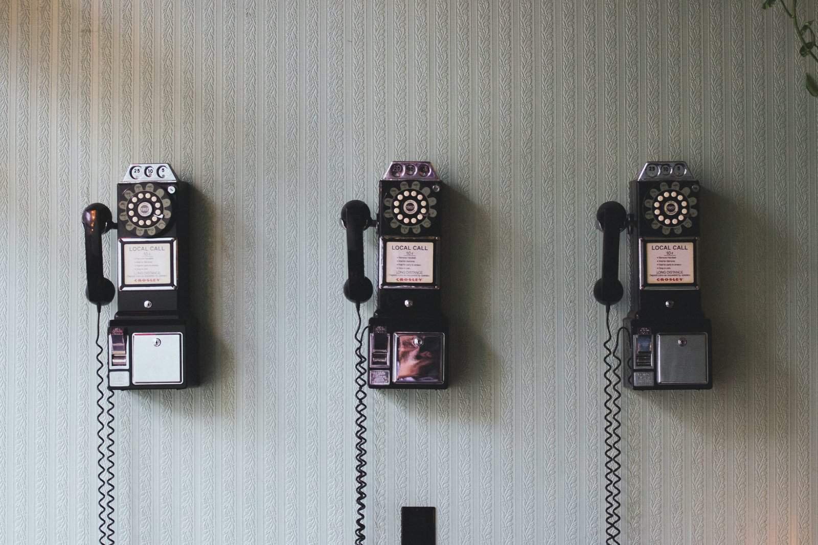 minimalist photography of three crank phones